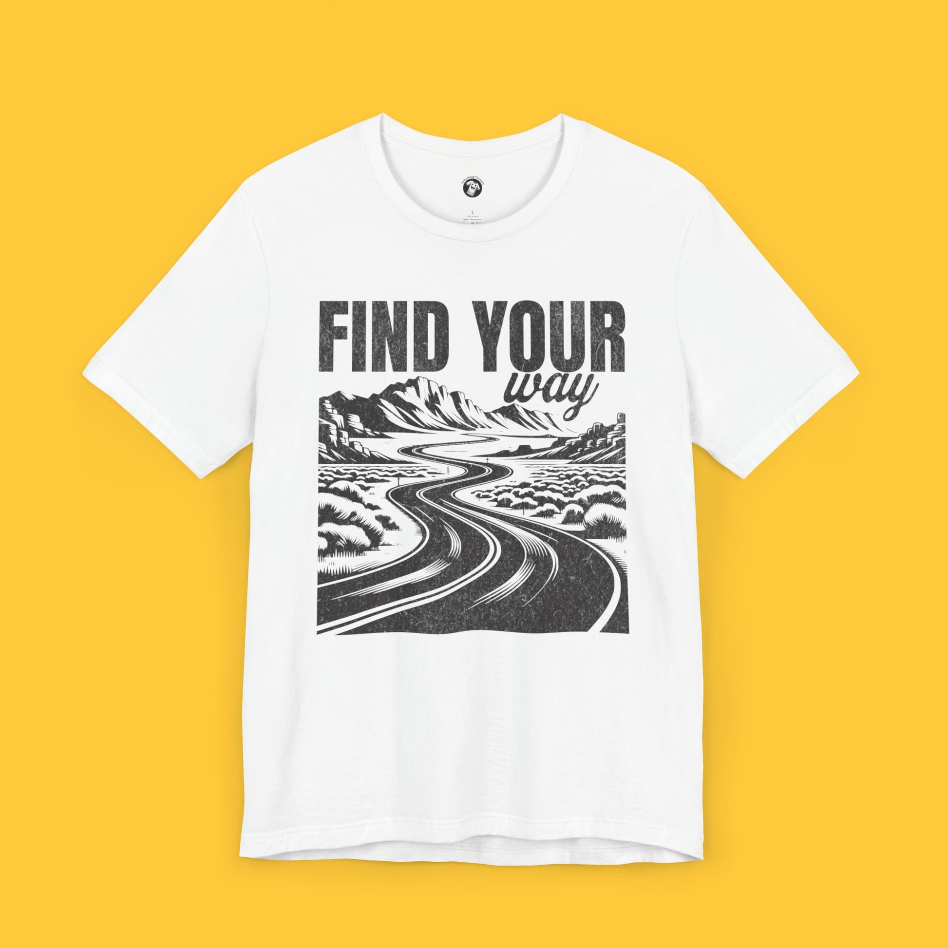 T-shirt featuring a landscape silhouette of a winding road through a desert with the quote "Find Your Way."