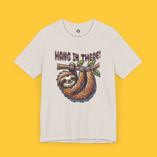 T-shirt with a cute sloth hanging from a branch and the quote "HANG IN THERE!" in a bubbly font.