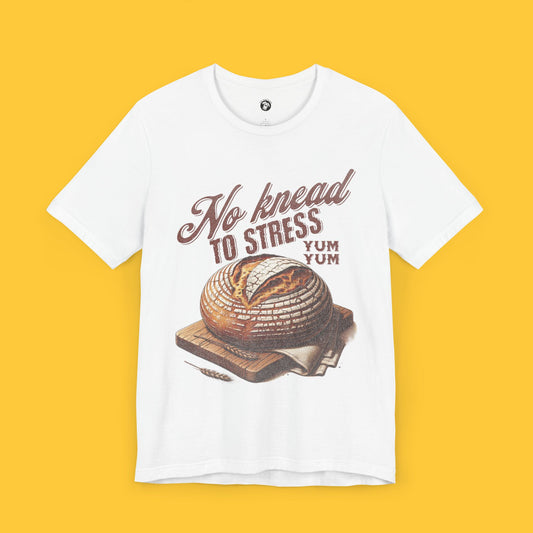 T-shirt featuring a detailed graphic of sourdough bread with the quote "No Knead to Stress" in a beautiful font.