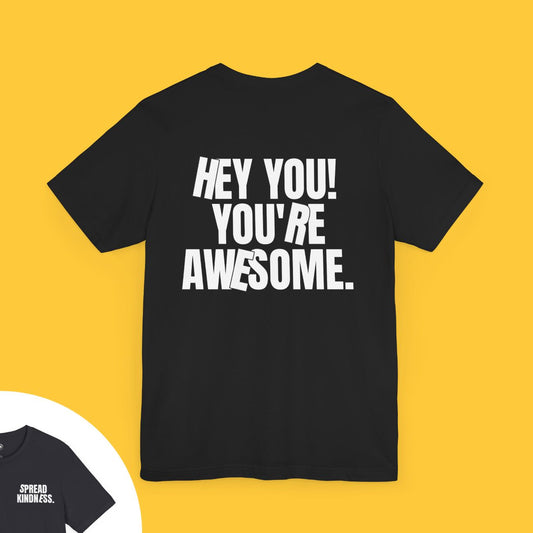 T-shirt with bold, all-caps typography on the back saying "HEY YOU! YOU’RE AWESOME" and "SPREAD KINDNESS" on the front left chest.