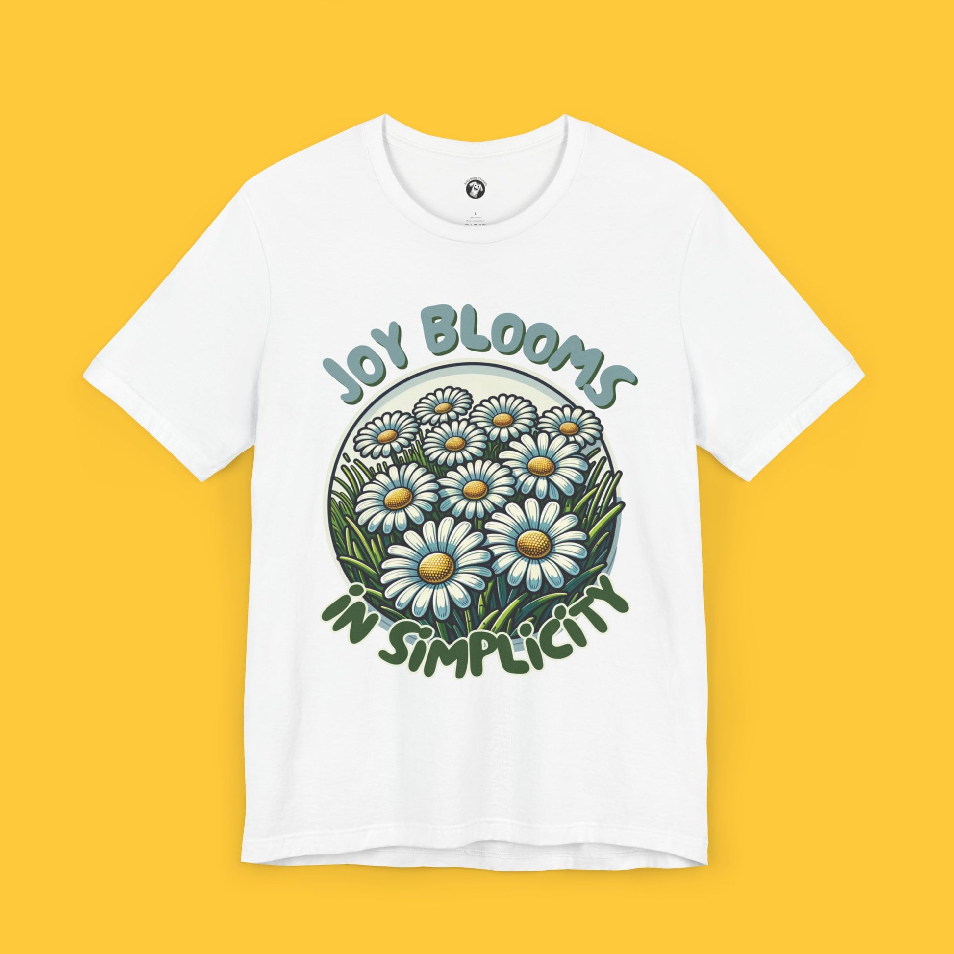  Embrace the beauty of simplicity with our "Joy Blooms in Simplicity" tee. Featuring a vibrant cluster of daisies encircled by a positive message, this shirt celebrates finding happiness in the simple things in life. The serene design and uplifting message make it perfect for everyday wear. Let this tee remind you that joy is all around, blossoming in the simplest moments. Ideal for nature lovers and anyone seeking a cheerful addition to their wardrobe.