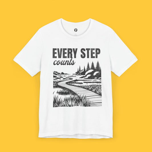 T-shirt featuring a landscape silhouette of a winding path through a serene setting with the quote "Every Step Counts."